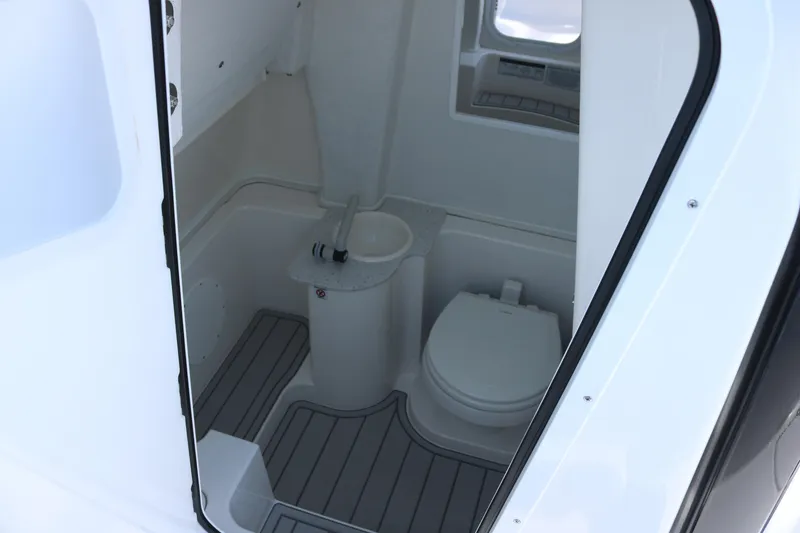 Slide: The Image of 2026 Sea Fox 268 Commander boat interior with compact marine toilet and sink. - 9