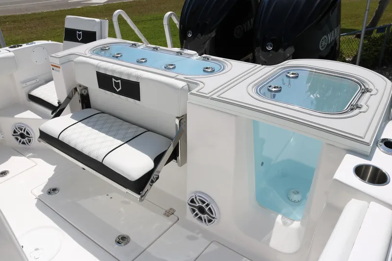 Slide: The Image of 2026 Sea Fox 288 Commander boat interior with seating and livewell compartments. - 14