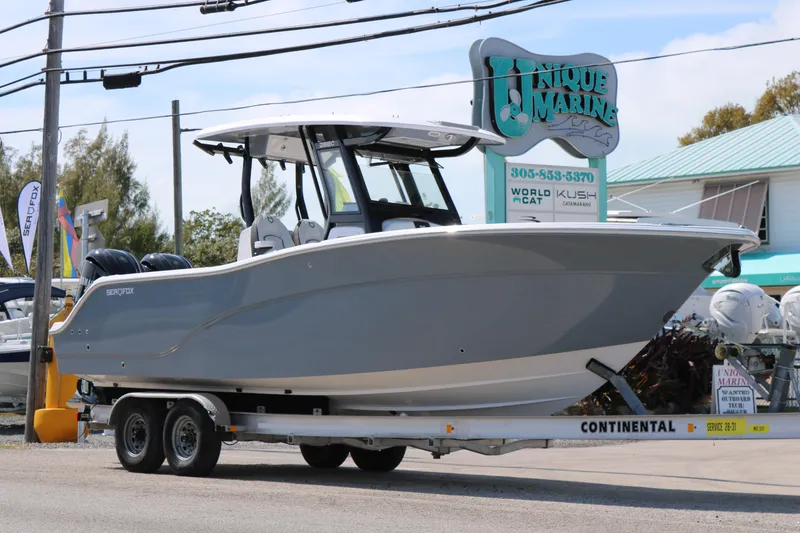 Slide: The Image of 2026 Sea Fox 288 Commander boat on trailer at Unique Marine dealership. - 3
