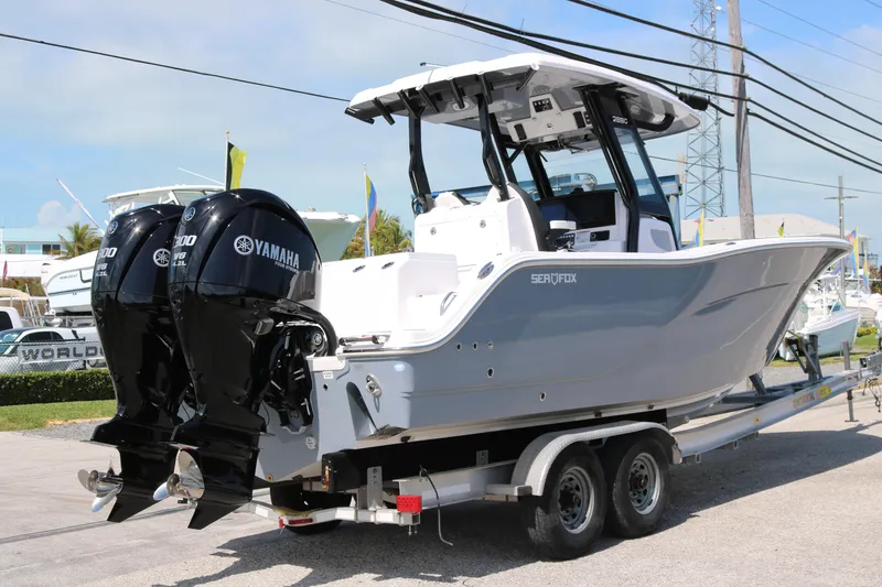 Slide: The Image of 2026 Sea Fox 288 Commander boat on trailer with twin Yamaha engines. - 4