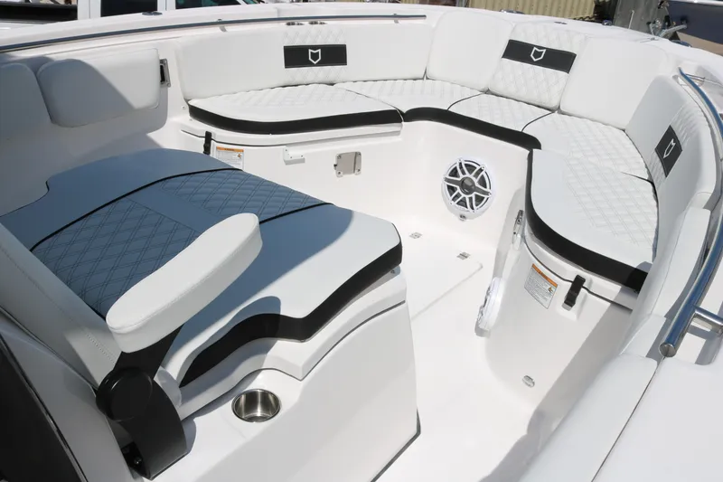 Slide: The Image of 2026 Sea Fox 288 Commander boat interior with white cushioned seating and speaker. - 9