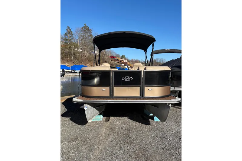 The Image of 2023 Bentley Pontoons 220 Navigator, docked, rear view with canopy, sunny day. - 0