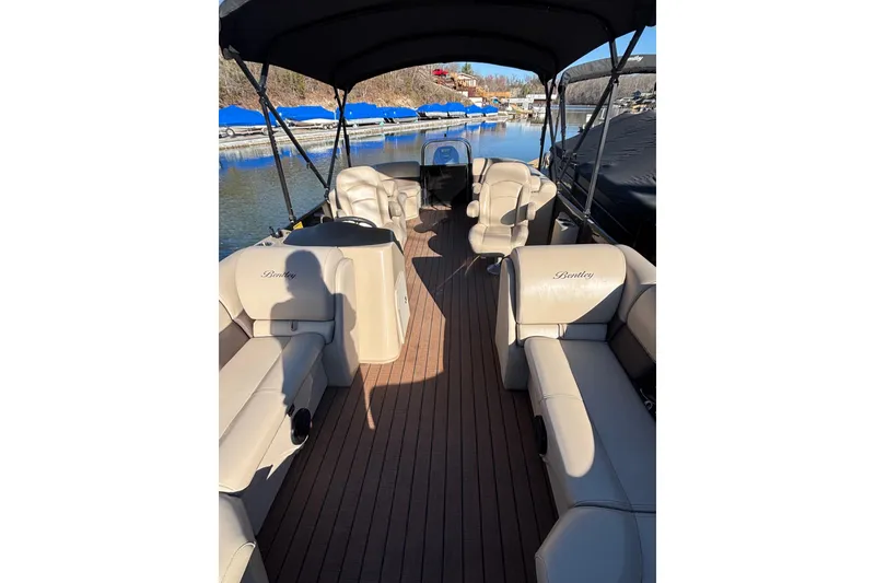 Slide: The Image of 2023 Bentley Pontoons 220 Navigator with spacious seating and elegant design on a sunny day. - 5