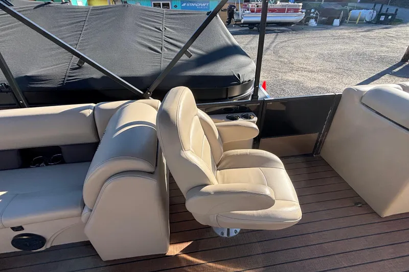 Slide: The Image of 2023 Bentley Pontoons 220 Navigator interior with beige seating and wood flooring. - 7