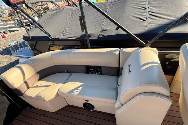 Slide: The Image of 2023 Bentley Pontoons 220 Navigator with luxurious beige seating and sleek design. - 8