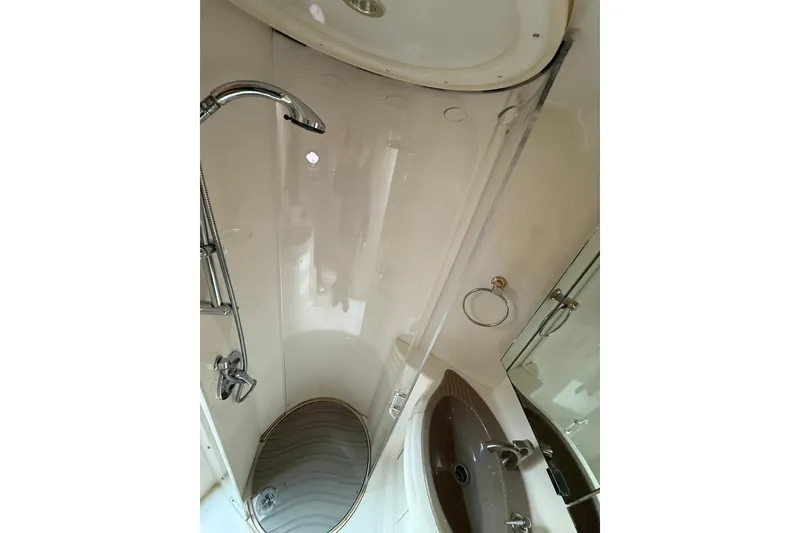 Slide: The Image of 1999 Maxum 4600 SCB yacht bathroom with shower and sink. - 21