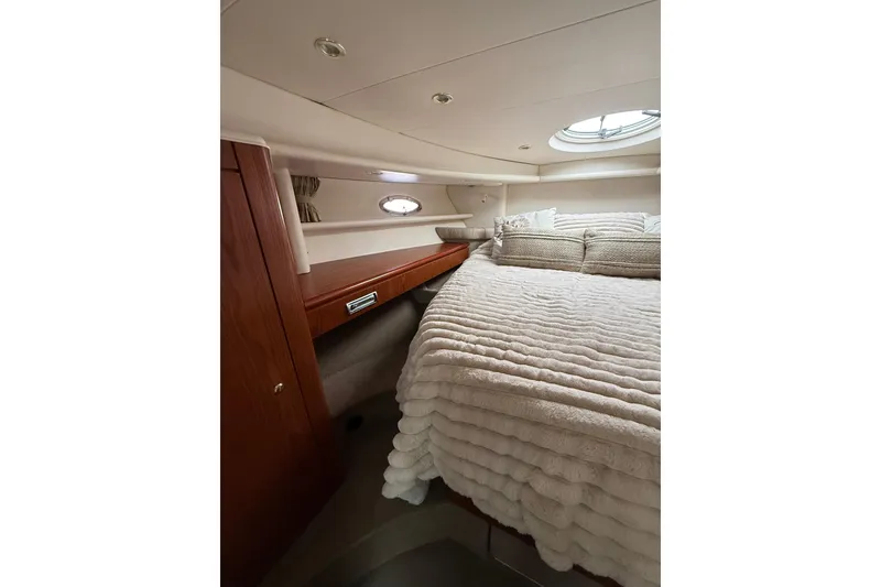 Slide: The Image of Luxurious cabin interior of 1999 Maxum 4600 SCB yacht with plush bedding. - 24