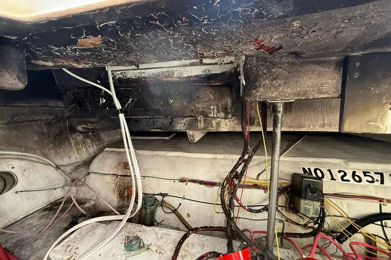 Slide: The Image of Engine compartment of a 1999 Maxum 4600 SCB boat, showing wiring and components. - 31