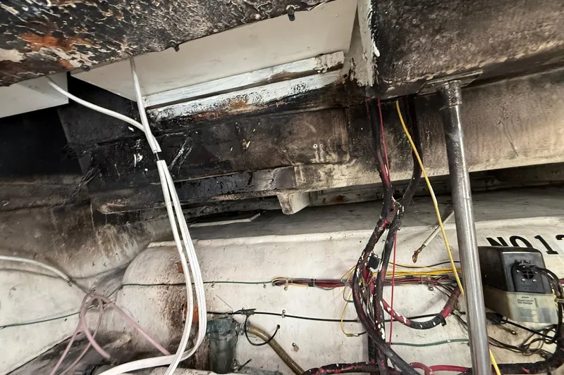 Slide: The Image of Interior of a 1999 Maxum 4600 SCB with cables and pipes. - 34