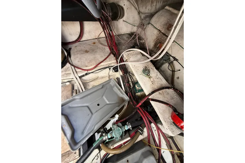 Slide: The Image of 1999 Maxum 4600 SCB engine room with cables and hoses. - 35