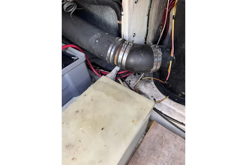 Slide: The Image of Engine compartment of 1999 Maxum 4600 SCB with hoses and wiring visible. - 38