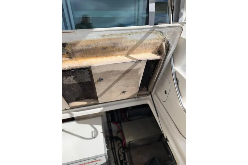 Slide: The Image of 1999 Maxum 4600 SCB engine compartment with open hatch, showing internal components. - 40