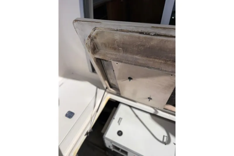 Slide: The Image of 1999 Maxum 4600 SCB engine compartment with open hatch, showcasing interior components. - 42