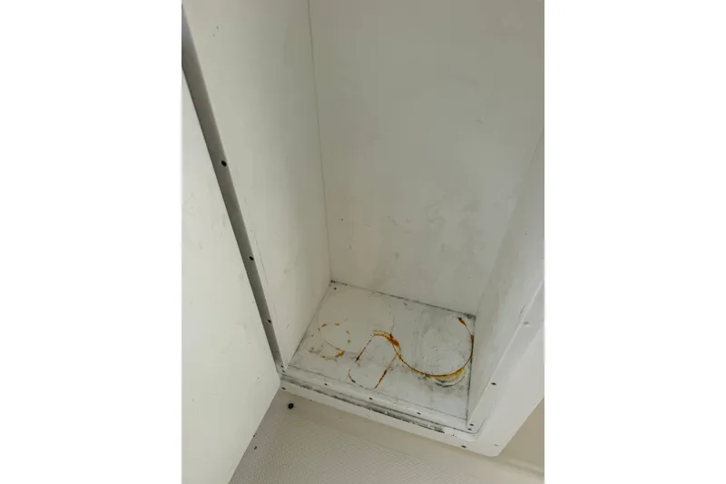 Slide: The Image of Interior compartment of 1999 Maxum 4600 SCB boat showing rust stains. - 5