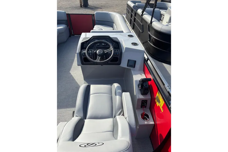 Slide: The Image of 2026 Bentley Pontoons Legacy 220 Cruise XL interior with steering console and seating. - 3