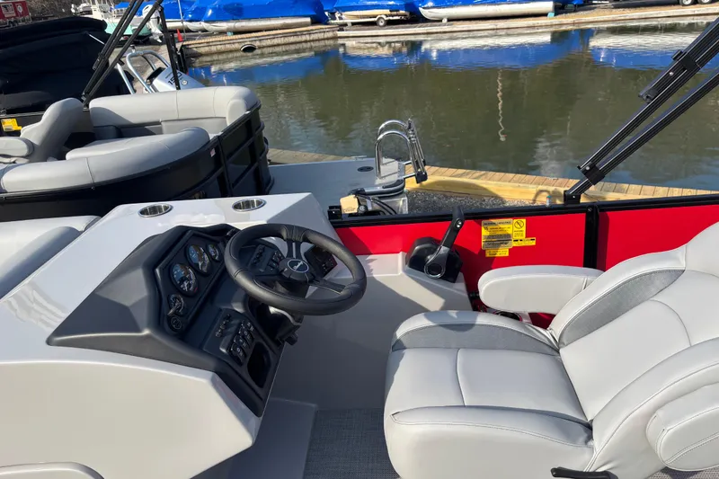 Slide: The Image of 2026 Bentley Pontoons Legacy 220 Cruise XL interior with steering wheel and seating. - 6