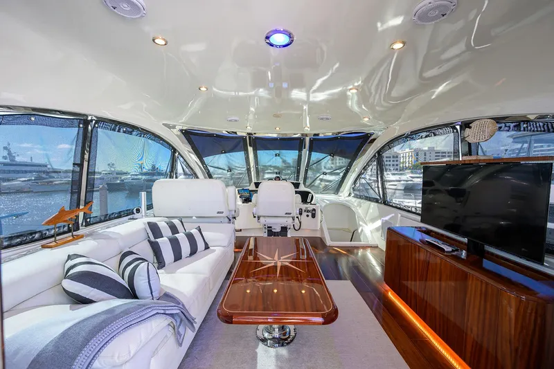 Slide: The Image of Luxurious interior of 2005 Lazzara 68 Enclosed Bridge yacht with elegant seating and modern amenities. - 16