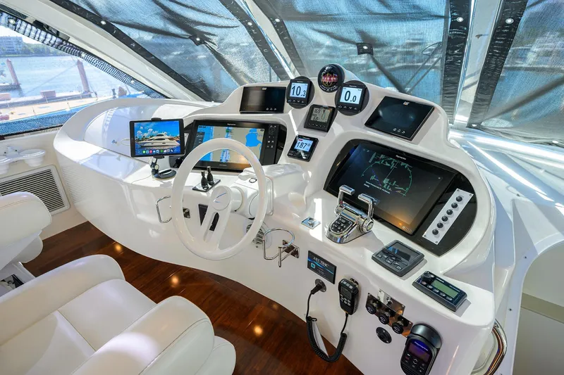 Slide: The Image of Control panel of 2005 Lazzara 68 Enclosed Bridge yacht with advanced navigation systems. - 23