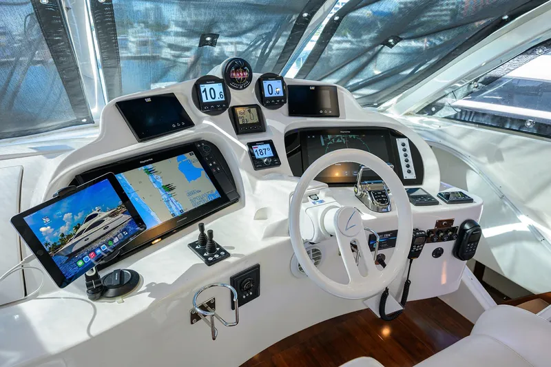 Slide: The Image of Cockpit of 2005 Lazzara 68 Enclosed Bridge yacht with advanced navigation systems. - 24