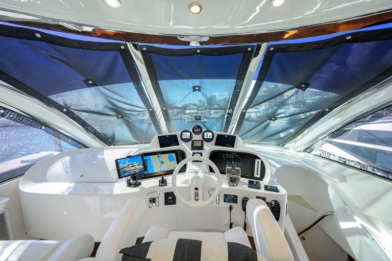 Slide: The Image of Helm of 2005 Lazzara 68 Enclosed Bridge yacht with modern navigation equipment. - 25