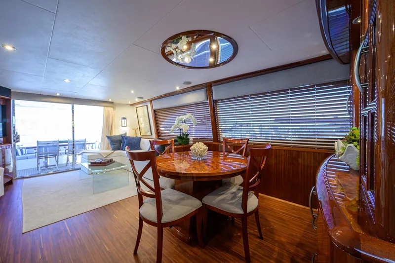 Slide: The Image of Luxurious interior of 2005 Lazzara 68 Enclosed Bridge yacht with elegant dining area. - 35