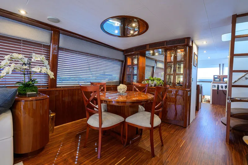 Slide: The Image of Luxurious interior of 2005 Lazzara 68 Enclosed Bridge yacht with elegant wood finishes. - 36