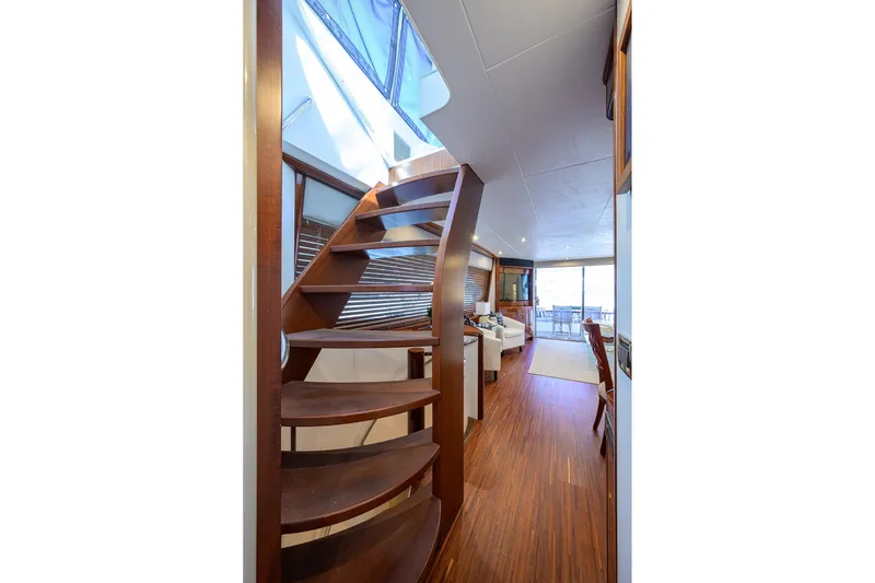 Slide: The Image of Interior of 2005 Lazzara 68 Enclosed Bridge yacht with wooden staircase and modern design. - 37