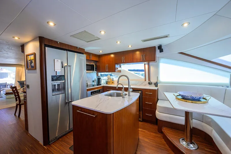 Slide: The Image of Luxurious kitchen interior of 2005 Lazzara 68 Enclosed Bridge yacht with modern amenities. - 39