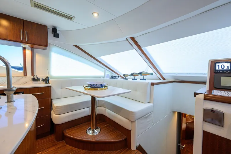 Slide: The Image of Luxurious interior of 2005 Lazzara 68 Enclosed Bridge yacht with modern seating and decor. - 43