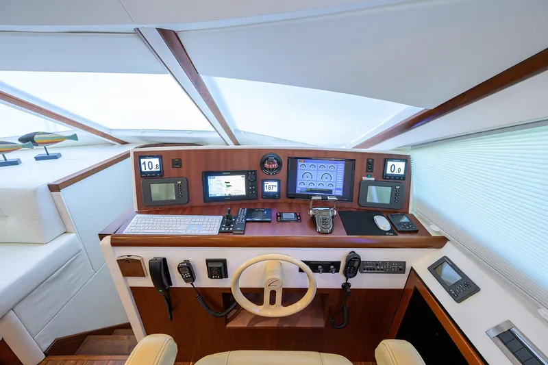 Slide: The Image of 2005 Lazzara 68 Enclosed Bridge yacht helm with advanced navigation equipment and controls. - 47