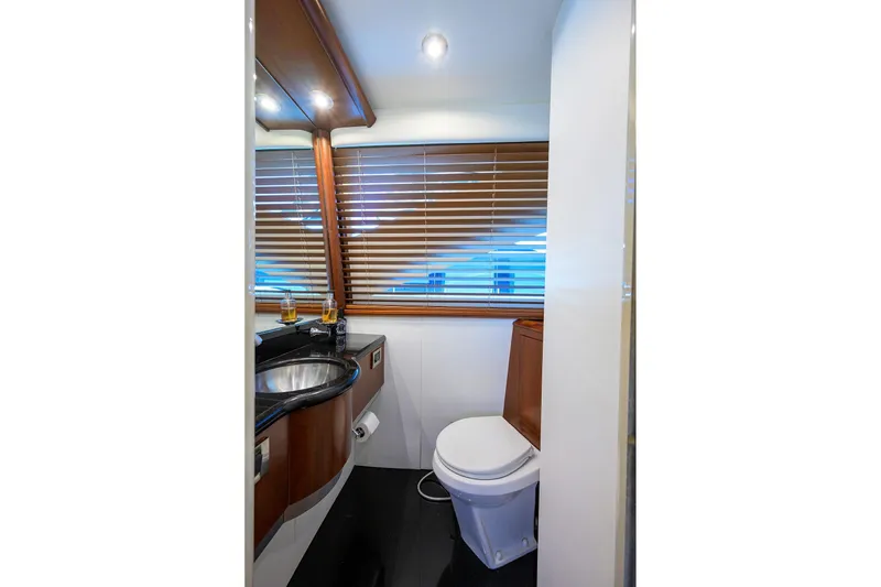 Slide: The Image of Luxurious bathroom in 2005 Lazzara 68 Enclosed Bridge yacht with modern fixtures. - 49
