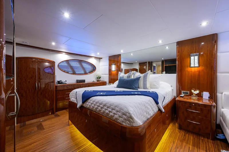 Slide: The Image of Luxurious bedroom interior of 2005 Lazzara 68 Enclosed Bridge yacht with elegant wood finishes. - 53