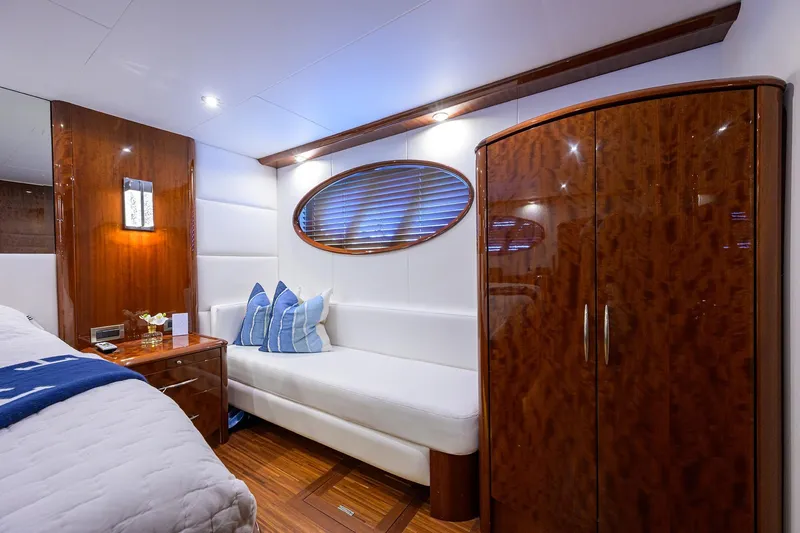 Slide: The Image of Luxurious interior of 2005 Lazzara 68 Enclosed Bridge yacht with elegant wood finishes. - 55