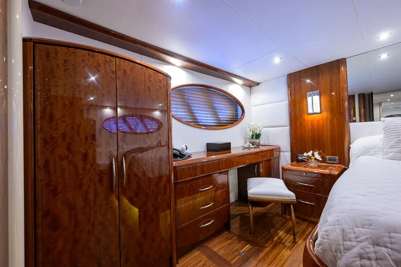 Slide: The Image of Luxurious cabin interior of 2005 Lazzara 68 Enclosed Bridge yacht with elegant wood finishes. - 56