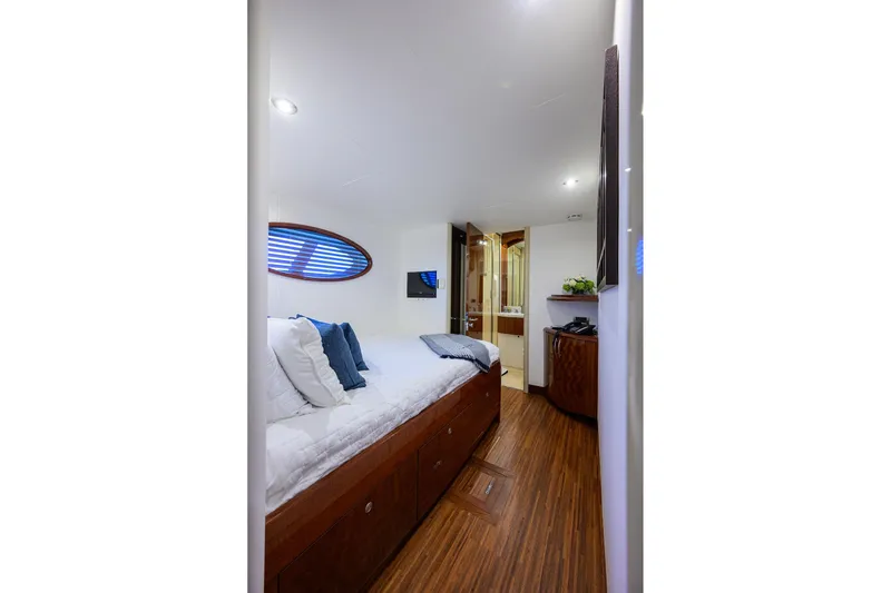 Slide: The Image of Luxurious cabin interior of 2005 Lazzara 68 Enclosed Bridge yacht with modern decor. - 62