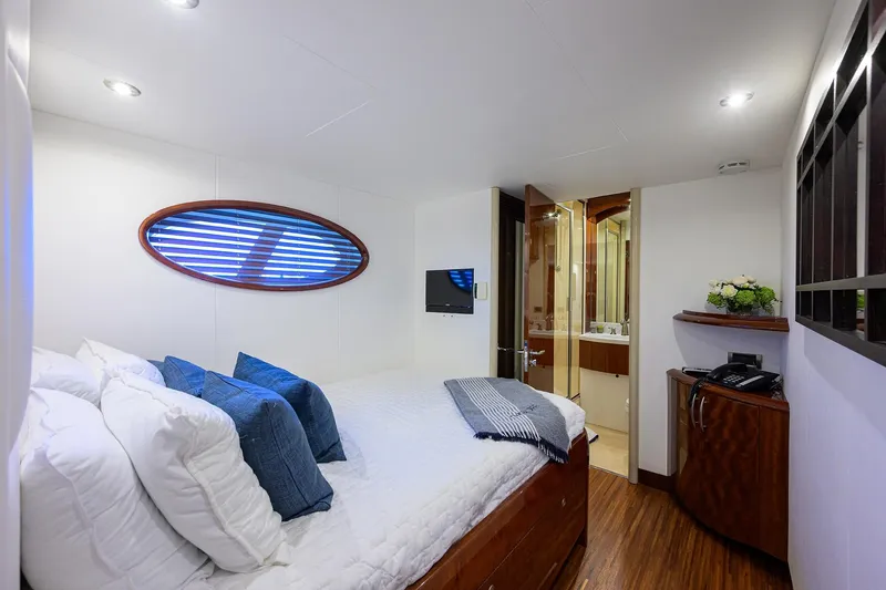 Slide: The Image of Luxurious bedroom interior of 2005 Lazzara 68 Enclosed Bridge yacht with modern amenities. - 63