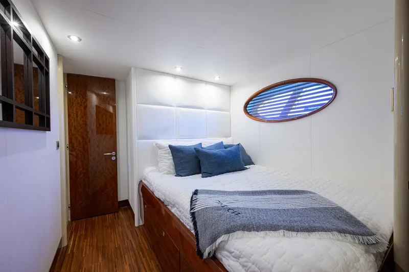 Slide: The Image of Luxurious bedroom interior on 2005 Lazzara 68 Enclosed Bridge yacht, featuring elegant design. - 64
