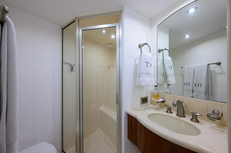 Slide: The Image of Luxurious bathroom in 2005 Lazzara 68 Enclosed Bridge yacht with shower and elegant fixtures. - 65