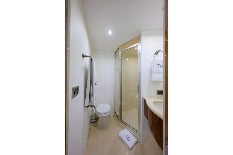 Slide: The Image of Luxurious bathroom in 2005 Lazzara 68 Enclosed Bridge yacht, featuring modern amenities. - 66