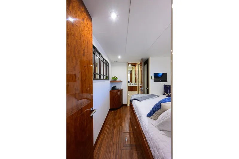 Slide: The Image of Luxurious bedroom interior of 2005 Lazzara 68 Enclosed Bridge yacht with elegant wood finishes. - 67