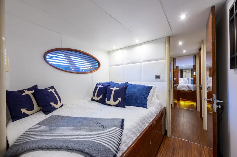 Slide: The Image of Luxurious bedroom interior of 2005 Lazzara 68 Enclosed Bridge yacht with nautical decor. - 68