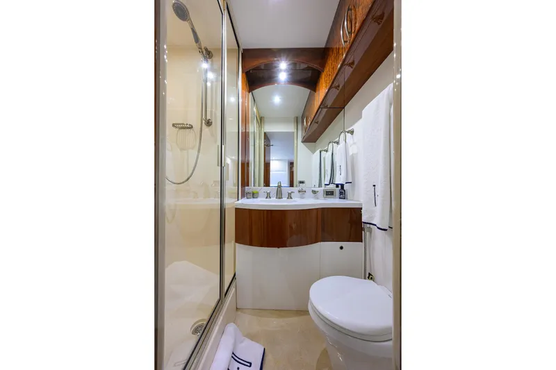 Slide: The Image of Luxurious bathroom in 2005 Lazzara 68 Enclosed Bridge yacht with modern fixtures and shower. - 69