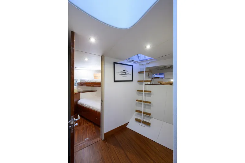 Slide: The Image of Interior of 2005 Lazzara 68 Enclosed Bridge yacht with bunk beds and ladder. - 74