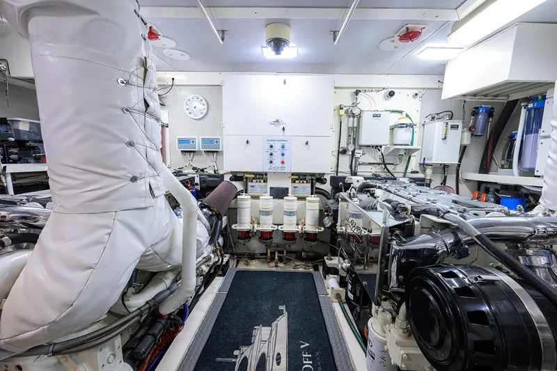 Slide: The Image of Engine room of 2005 Lazzara 68 Enclosed Bridge yacht, showcasing machinery and equipment. - 80