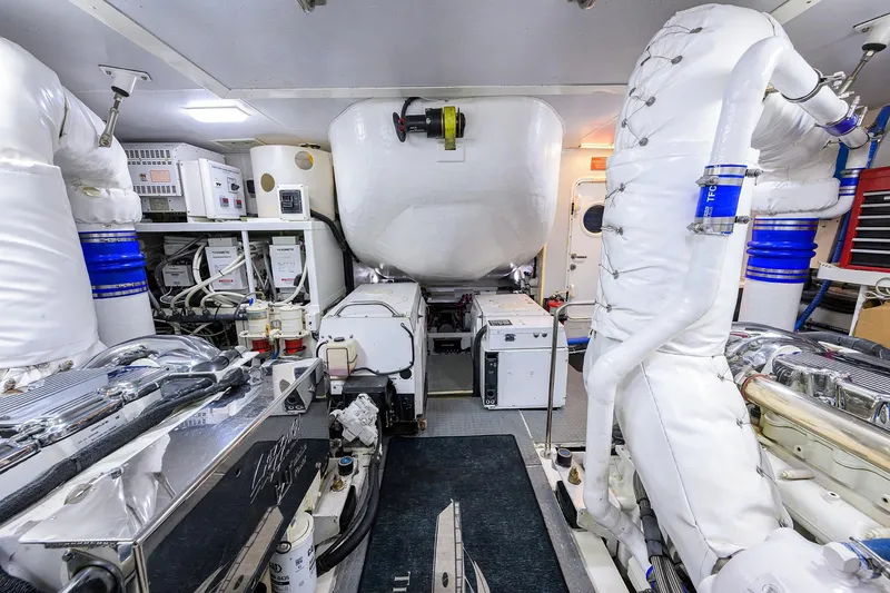 Slide: The Image of Engine room of 2005 Lazzara 68 Enclosed Bridge yacht, showcasing advanced machinery and equipment. - 84
