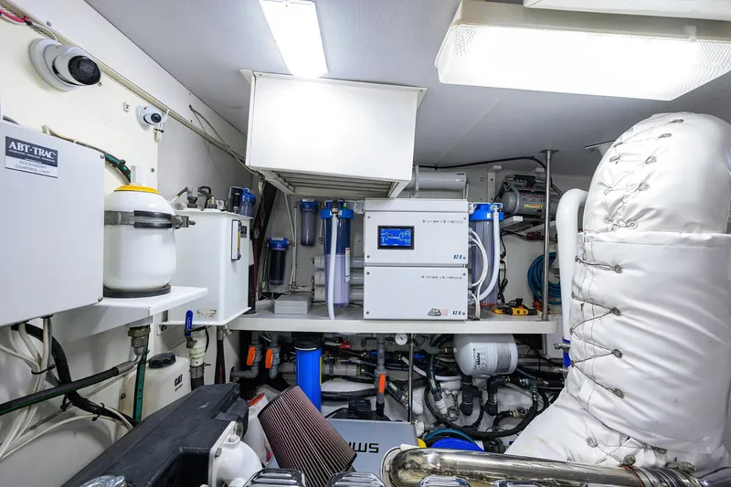 Slide: The Image of Engine room of 2005 Lazzara 68 Enclosed Bridge yacht, featuring advanced control systems. - 85