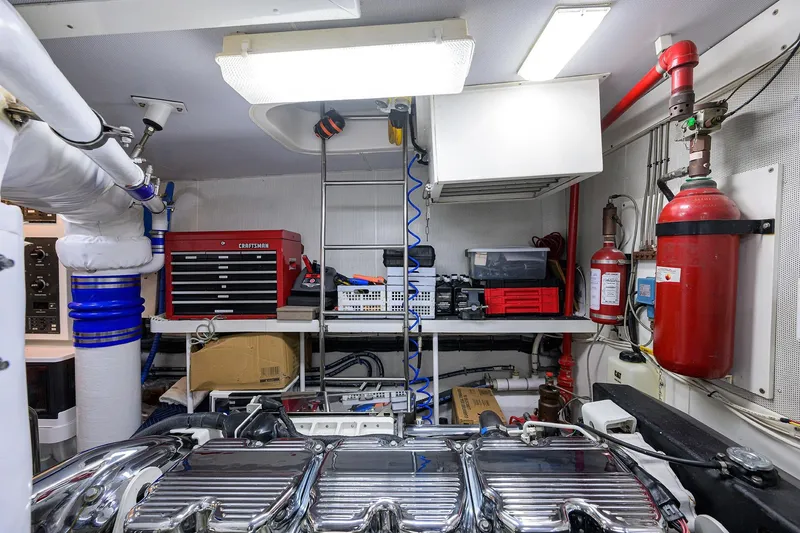 Slide: The Image of Engine room of 2005 Lazzara 68 Enclosed Bridge yacht with tools and equipment. - 86
