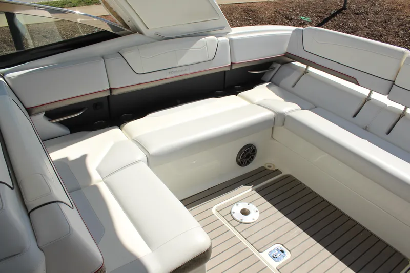 Slide: The Image of 2018 Formula 350 Crossover Bowrider interior with white seating and teak-style flooring. - 10