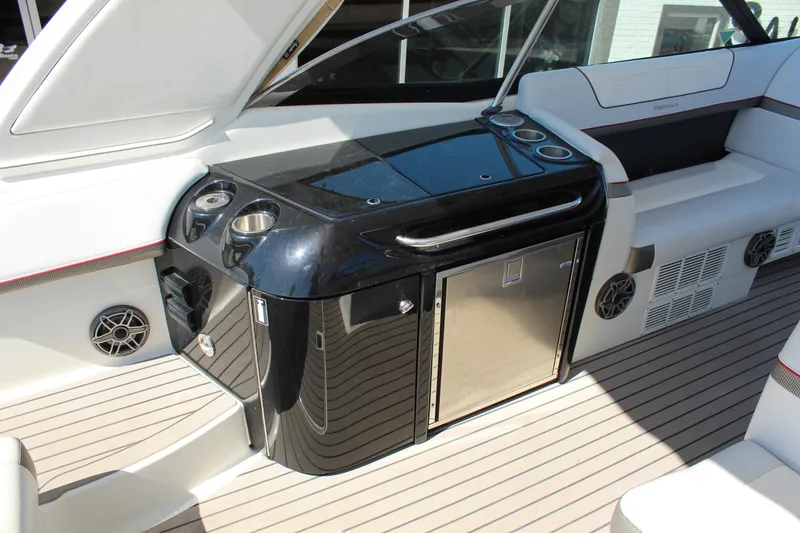 Slide: The Image of 2018 Formula 350 Crossover Bowrider interior with sleek black console and stainless steel accents. - 11