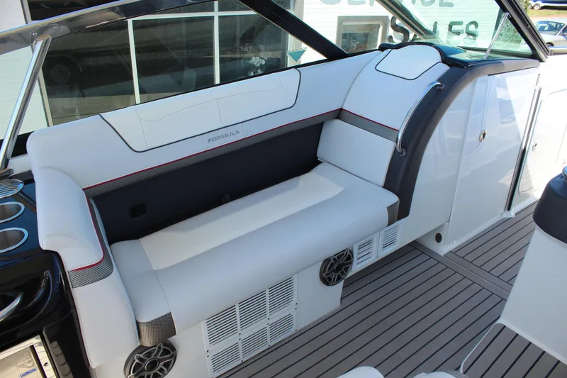 Slide: The Image of 2018 Formula 350 Crossover Bowrider interior with white seating and modern design. - 12